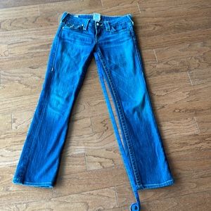 True Religion low rise. Sparkly buttons on front and back of jeans.